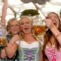 Girls celebrate during the opening of the Oktoberfest beer festival at the Theresienwiese in Munich, southern Germany, on September 21, 2013. The world's biggest beer festival Oktoberfest will run until October 6, 2013.  AFP PHOTO / CHRISTOF STACHE