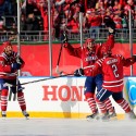 WASHINGTON, DC - JANUARY 01:  Eric Fehr #16 of the Washington Capitals celebrates with teamates following his first period goal against the Chicago Blackhawks in the 2015 NHL Winter Classic at Nationals Park on January 1, 2015 in Washington, DC.  (Photo by Rob Carr/Getty Images)