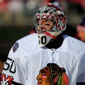WASHINGTON, DC - JANUARY 01: Corey Crawford #50 of the Chicago Blackhawks looks on wearing eye black during the 2015 NHL Winter Classic against the Cleveland Browns at Nationals Park on January 1, 2015 in Washington, DC.  (Photo by Rob Carr/Getty Images)