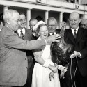 President  Harry Truman stands at arms' length as he inspects a turkey presented to him on Nov. 16, 1949 by a group of turkey raisers.    Meanwhile, Mrs. Arthur Hinds of Lexington, Mass., dressed in a Pilgrim costume, keeps a tight grip on the bird's legs.   Left to right: Truman, Leon Todd of Trenton, N.J., C.C. Edmonds of Salt Lake City, Mrs. Hinds, Lionel Mercier of Grandy, Mass., C. Fred Smith of New York and N. R. Clark of Chicago.  Mercier raised the 40-pound turkey. (AP Photo)